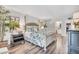 Spacious main bedroom offers a decorative bed, ample lighting, and an en-suite bathroom at 6501 Mourning Dove Dr # 215, Bradenton, FL 34210