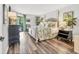 Bright main bedroom featuring a decorative bed frame and access to a private outdoor space at 6501 Mourning Dove Dr # 215, Bradenton, FL 34210