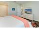 Light and airy bedroom featuring a dresser with a TV and neutral decor at 7136 Summerland Cv, Bradenton, FL 34202