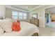Bright bedroom featuring shutters, a ceiling fan, and a light wood dresser at 7136 Summerland Cv, Bradenton, FL 34202