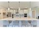 Well-equipped kitchen with an island bar, stainless steel appliances, and ample counter space for cooking at 7136 Summerland Cv, Bradenton, FL 34202