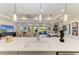 The house features a modern open concept living, dining, and entertainment area at 7136 Summerland Cv, Bradenton, FL 34202