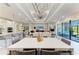 Bright, open-concept living space connecting the kitchen, dining, and living areas with seamless flow at 7136 Summerland Cv, Bradenton, FL 34202