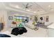 Bright, open living room with stylish decor, comfortable seating, and a view of the screened lanai at 7136 Summerland Cv, Bradenton, FL 34202