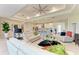 Spacious living area with modern design, open to the kitchen, and featuring a comfortable seating arrangement at 7136 Summerland Cv, Bradenton, FL 34202