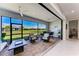 Inviting outdoor patio with comfortable seating, ceiling fans, and a view of the yard at 7136 Summerland Cv, Bradenton, FL 34202