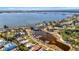 Stunning aerial view of waterfront homes, canal, and boat docks with access to bay and ocean at 7817 Alhambra Dr, Bradenton, FL 34209