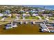 Aerial view of a residential neighborhood with docks and boats on a waterfront property at 7817 Alhambra Dr, Bradenton, FL 34209