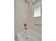 Modern bathroom features tiled shower with a window and sleek fixtures at 7817 Alhambra Dr, Bradenton, FL 34209