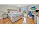Cozy bedroom with a beach theme, wooden bed frame, and adjacent work area at 7817 Alhambra Dr, Bradenton, FL 34209
