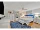 Comfortable bedroom with blue accents, hardwood floors, and ample natural light at 7817 Alhambra Dr, Bradenton, FL 34209