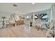 Inviting foyer with a stylish console table, comfortable bench, and bright, airy ambiance at 7817 Alhambra Dr, Bradenton, FL 34209