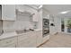 Close-up of the kitchen with modern stainless steel appliances and white cabinetry, offering a clean look at 7817 Alhambra Dr, Bradenton, FL 34209