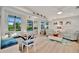 Bright living room featuring a cozy breakfast nook and view of the pool at 7817 Alhambra Dr, Bradenton, FL 34209
