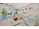 Bright living room featuring comfortable seating and direct access to the pool at 7817 Alhambra Dr, Bradenton, FL 34209