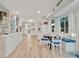 Open living area with breakfast nook, showcasing bright and modern design at 7817 Alhambra Dr, Bradenton, FL 34209