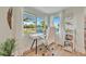 Bright home office featuring a modern desk, comfortable chair, and scenic water view at 7817 Alhambra Dr, Bradenton, FL 34209