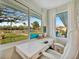 This home office features a spacious desk with a tranquil waterfront view at 7817 Alhambra Dr, Bradenton, FL 34209