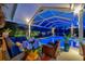 Spacious patio area featuring comfortable seating, lush plants, and access to the enclosed pool at 7817 Alhambra Dr, Bradenton, FL 34209