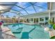 A sparkling screened-in pool with a sun deck and outdoor seating, perfect for relaxation and entertaining by the pool at 7817 Alhambra Dr, Bradenton, FL 34209