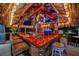The tiki bar features bamboo accents, colorful decor, and stocked liquor shelves at 7817 Alhambra Dr, Bradenton, FL 34209
