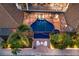 Aerial view of the stunning screened pool, patio, and lush landscaping of this waterfront property at 801 3Rd E St, Palmetto, FL 34221
