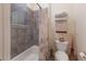 This is a bathroom with a white tub and seashell-themed shower curtain at 801 3Rd E St, Palmetto, FL 34221