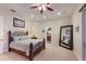 Spacious bedroom with a large mirror and a doorway to another room at 801 3Rd E St, Palmetto, FL 34221