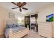 Charming bedroom featuring a balcony with sunset views and a dresser at 801 3Rd E St, Palmetto, FL 34221