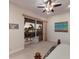 Bright bedroom featuring a ceiling fan, balcony access, and lovely views at 801 3Rd E St, Palmetto, FL 34221