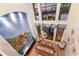 Elegant dining room with high ceilings, mural, and gorgeous views of the community lake beyond the patio at 801 3Rd E St, Palmetto, FL 34221