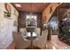 Stylish dining room with unique lighting and an adjacent wine cellar for elegant entertaining at 801 3Rd E St, Palmetto, FL 34221