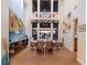 Elegant dining room with mural, chandelier, large windows and water view at 801 3Rd E St, Palmetto, FL 34221