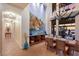 This elegant dining room features a mural, large windows, water views, and stylish lighting at 801 3Rd E St, Palmetto, FL 34221