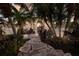 Elegant home featuring a stone walkway, manicured landscaping, and a grand entrance at 801 3Rd E St, Palmetto, FL 34221
