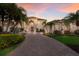 Inviting front facade with manicured landscaping and a spacious brick driveway at 801 3Rd E St, Palmetto, FL 34221