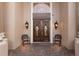 Elegant home entrance featuring custom double doors and stylish exterior lighting at 801 3Rd E St, Palmetto, FL 34221