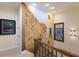 Hallway features a wall mural, wood handrail with iron spindles, and plenty of natural light at 801 3Rd E St, Palmetto, FL 34221