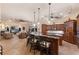 The kitchen has granite countertops, stainless appliances, and seating that opens up to the living area with fireplace at 801 3Rd E St, Palmetto, FL 34221