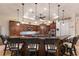 Open kitchen with granite countertops, wood cabinets, and an island with seating at 801 3Rd E St, Palmetto, FL 34221
