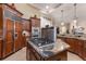 This kitchen boasts stainless steel appliances and a large gas cooktop atop an island with striking granite counters at 801 3Rd E St, Palmetto, FL 34221