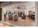 Open-concept living space with access to the kitchen and a living room with a fireplace and entertainment center at 801 3Rd E St, Palmetto, FL 34221