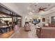 Open living space leads to outdoor patio and dining area. Features fireplace, entertainment center and waterfront views at 801 3Rd E St, Palmetto, FL 34221