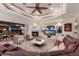 Spacious living room with fireplace, entertainment center and access to an enclosed patio with outdoor dining area at 801 3Rd E St, Palmetto, FL 34221