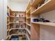 Spacious walk-in pantry features ample shelving for optimal storage and organization of kitchen staples at 801 3Rd E St, Palmetto, FL 34221