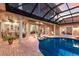 Expansive pool and patio area surrounded by lush landscaping, perfect for relaxation and outdoor gatherings at 801 3Rd E St, Palmetto, FL 34221
