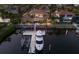 Waterfront home featuring a private dock, a large boat, and outdoor seating area for entertaining at 801 3Rd E St, Palmetto, FL 34221