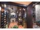 Stunning wine cellar with extensive bottle storage, custom lighting, and elegant wood accents at 801 3Rd E St, Palmetto, FL 34221
