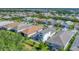 Aerial view of the community featuring well-maintained homes, lush greenery, and neatly manicured lawns at 8069 Tidal Pointe Way, Sarasota, FL 34240