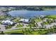 Aerial view of community center, clubhouse, and pool overlooking lake at 8069 Tidal Pointe Way, Sarasota, FL 34240